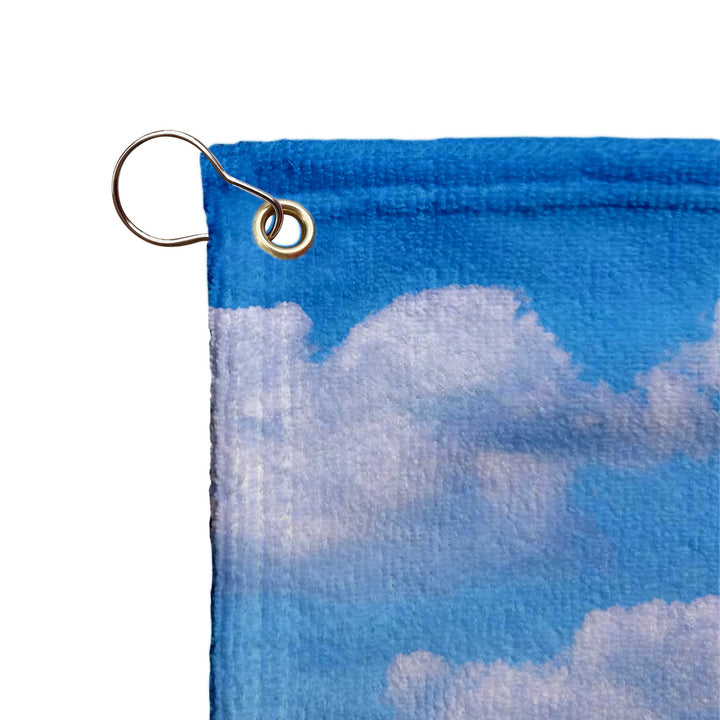 a keychain with a picture of clouds on it